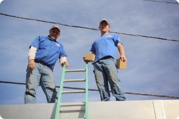 Waterbury employees on a roof