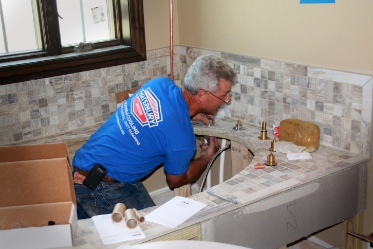 Waterbury Worker Repairing Bathtub